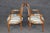 This elegant pair of early 1900s French Louis XVI style oval-back fauteuils beautifully captures the refined elegance and...