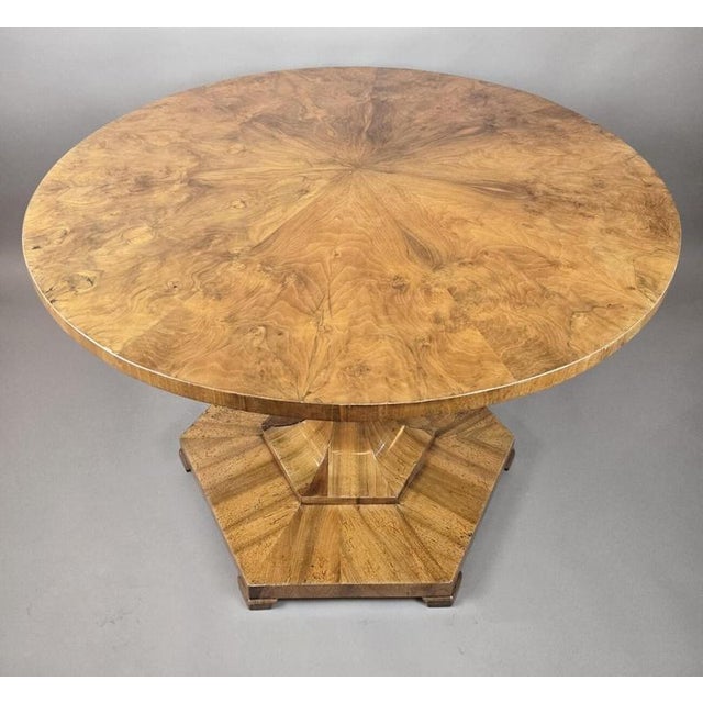 Biedermeier pedestal table with a folding top in burr walnut, 19th century