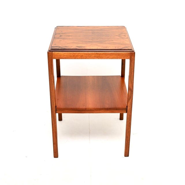 A stylish and useful Art Deco burr walnut side table. This was made in England, it dates from the 1930’s. It is of fine...