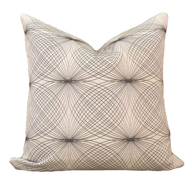 This free-spirited fabric design features swirling lines in shades of gray on an ivory woven background. At home in mid-...