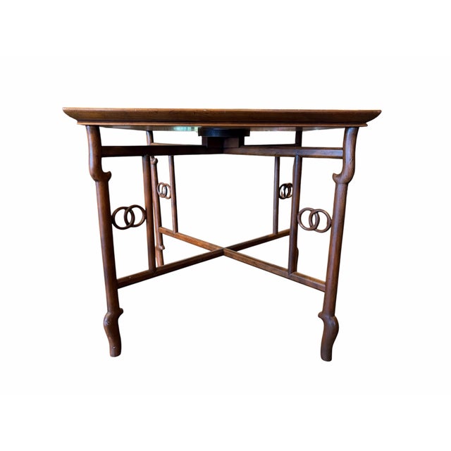 An elegant and highly collectible mid-century side table designed by renowned American designer Michael Taylor for Baker...