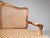 Exquisite Louis XV style hand carved French caned settee with loose notched cushion. Crafted in Italy c. 1980's, ready for...