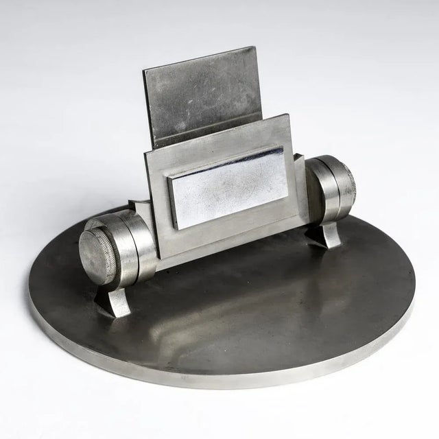 This rare early table mirror by Maison Desny, made with nickel-plated and painted metal, shows the avant-garde design and...