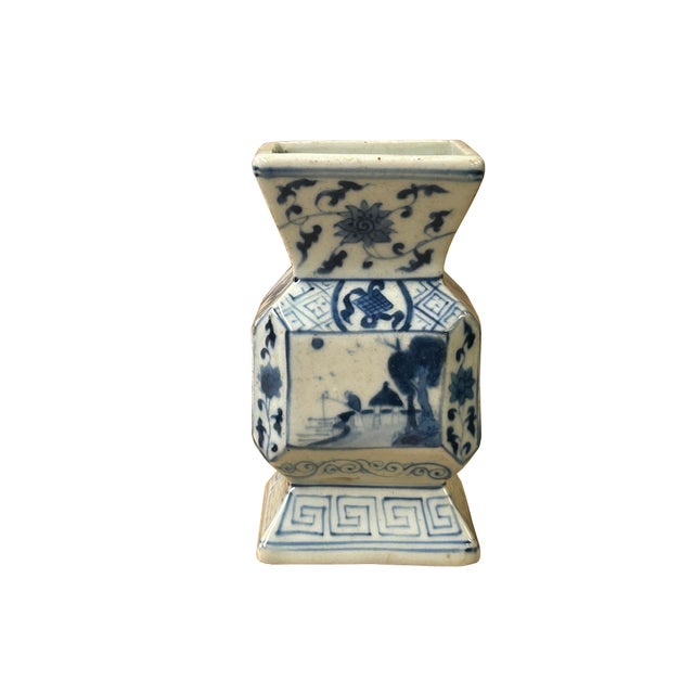 This exquisite antique Chinese blue and white ceramic vase jar is finely rendered in an unusual faceted, baluster-inspired...