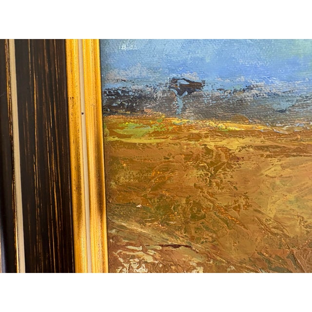 This is a late 20th century vintage impressionist landscape painting. This painting is presented in a dark brown and gold...
