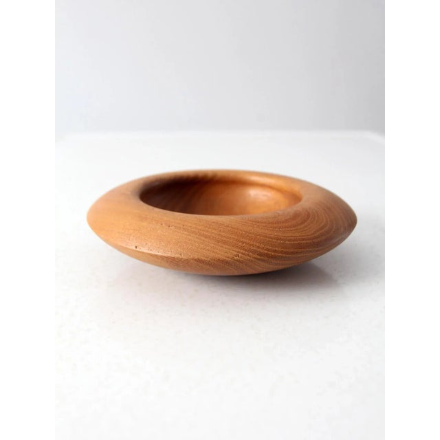 This is a vintage hand-crafted wood bowl. The hollow form bowl has a beautiful wood grain.