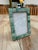 Elegant vintage picture frame featuring a mosaic-style border composed of rectangular green stone tiles. The natural...