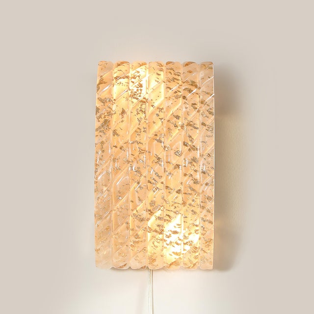 This exquisite pair of modernist Murano glass sconces, crafted in Italy in the 21st century, beautifully combines...