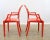 Set of four molded plastic armchairs in red, after the “Louis” chair design by Philippe Starck for Kartell. Produced in a...
