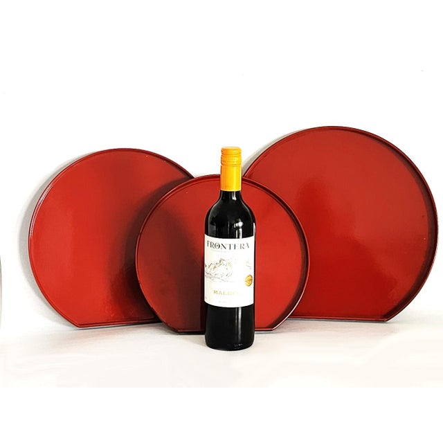 Offered is a set of 3 lacquered melamine nesting trays designed by Larry Laslo for Mikasa. They are a rich...