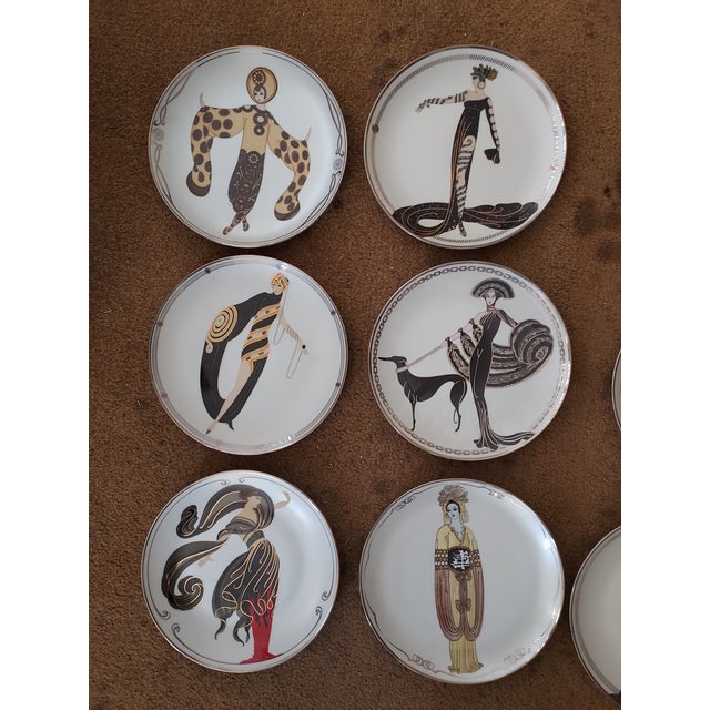 Set of 9 collectible Erte plates.