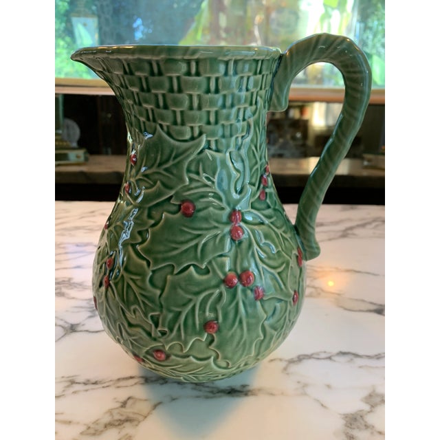 Darling green and red majolica pitcher in the form of Holly Leaves and Berries with Basketweave. Made in Portugal by...