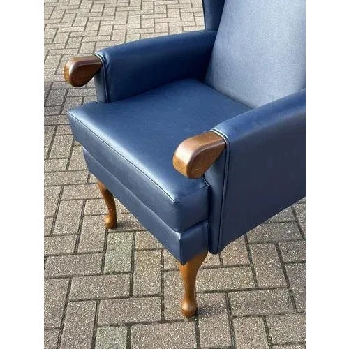 Blue Leather Armchair & Matching Foot Stool. Sizes:- 108 cms high, 67 cms depth, 66 cms wide. A used item so will have...