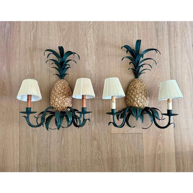 Offered is a vintage pair of Currey & Company wall lights. These pineapple wall lights were acquired from a Naples estate.