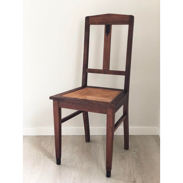 This pair of custom-made Art Deco dining chairs, crafted in the Netherlands in the 1920s, showcases the bold and...