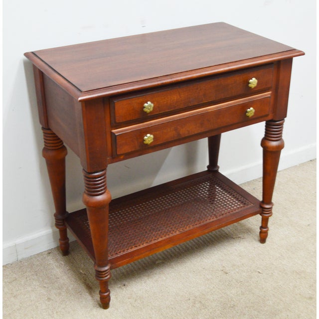 Bedside Table by Ethan Allen. Store item #540. It features two drawers and caned shelf.