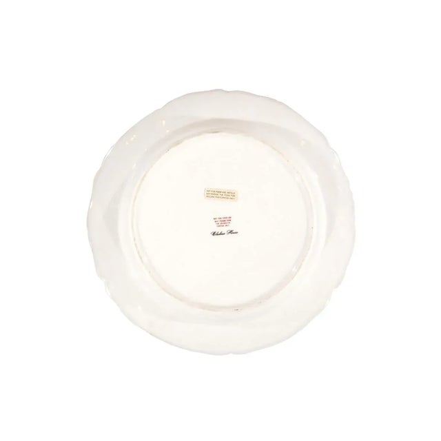 This lovely of Decorative Bird Plates, feature a vibrant White Border, delicate Green Trim, and White Floral Swags.