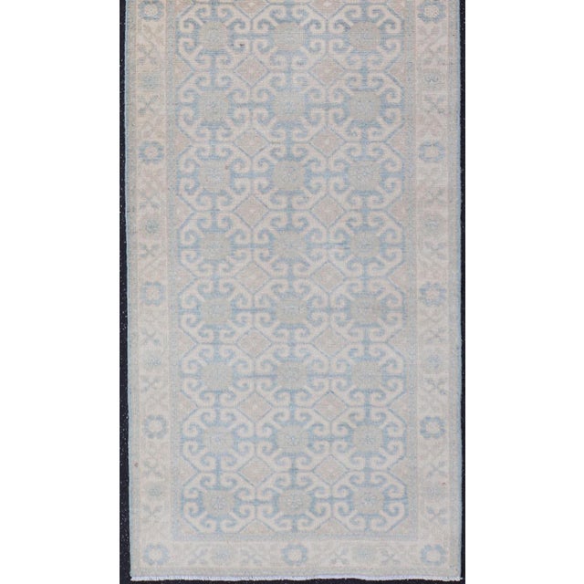 Tribal Afghan Khotan Tribal Runner in Ivory With Soft Blue and Sand Motifs For Sale - Image 3 of 10