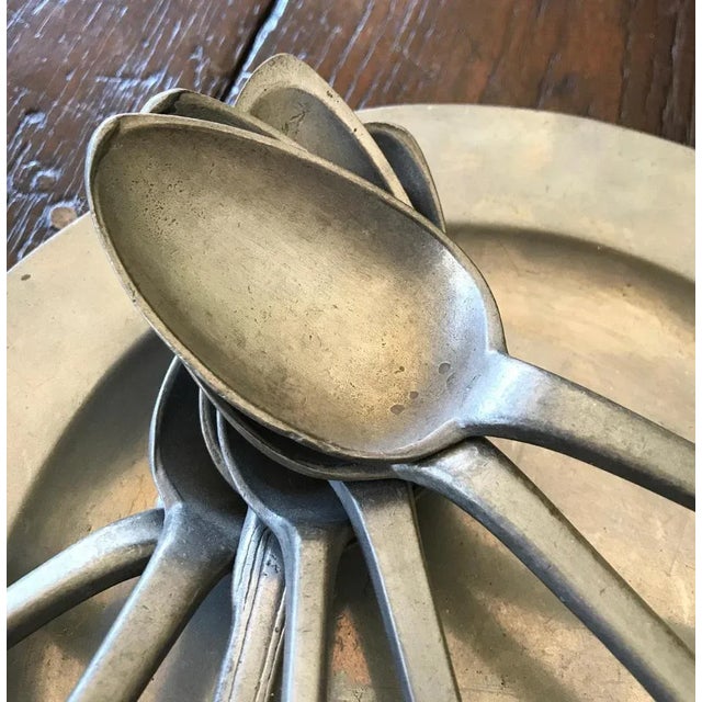 Plate London in pewter 24 cm 7 spoons in pewter 19th century.