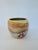 Small vintage Nemadji Bowl featuring a swirled red, orange and yellow design. Produced in Minnesota from clay on the banks...