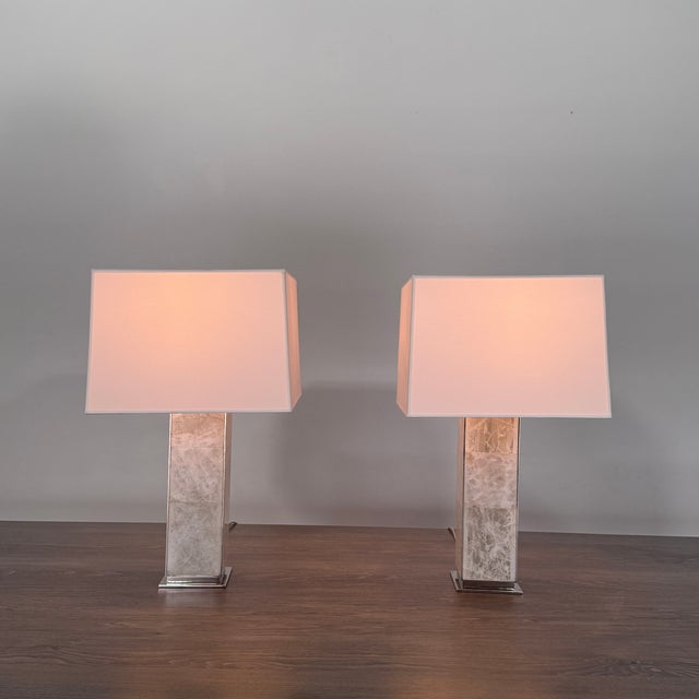 Elevate your interior with this designer table lamp that balances natural materials and refined craftsmanship. The Ellis...