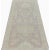 This traditional handwoven Oushak style area rug features a recreated Vintage design. The elegant light pink colored field...