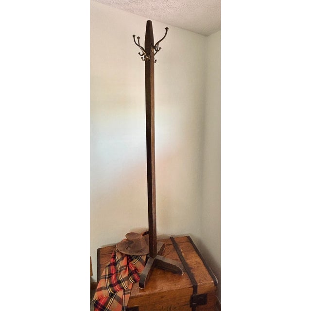 Features a 69-inch tall solid oak tapered central post anchored by a rugged 20-inch cross-braced base for maximum...