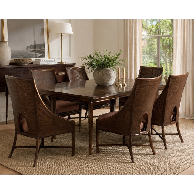 A striking set of six authentic McGuire Furniture dining chairs blending organic texture with refined coastal...