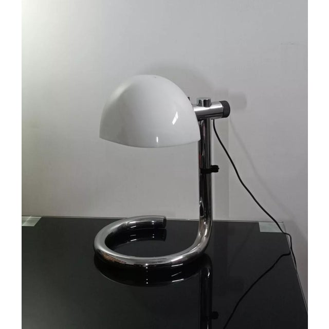 Magnificent and imposing designer table lamp by Metalarte. Spain, 1970s. Chrome-plated metal base with a wavy design....