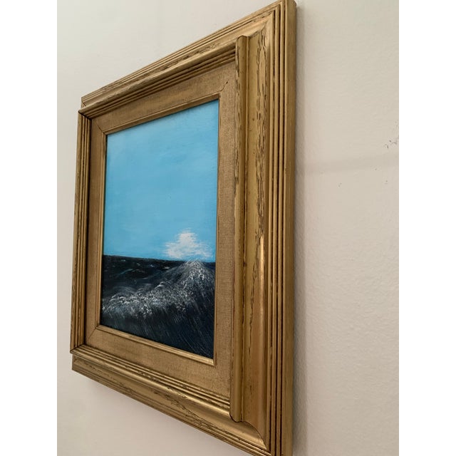 This striking seascape features richly saturated blues, capturing the movement and depth of open water, accented by a...