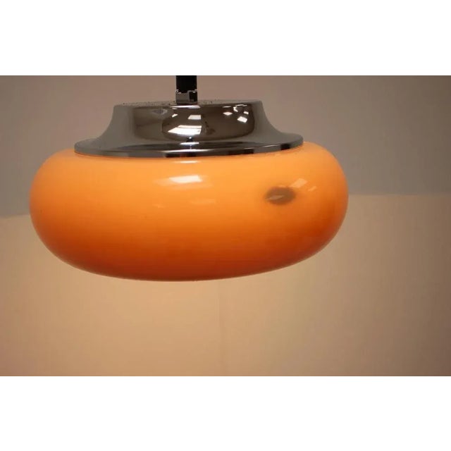 Big pendant by Meblo, Italy, 1970's. Beige-orange plastic shade, in good condition overall, only some minor scratches from...