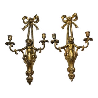 Early 20th Century Pair of Monumental 22” French Louis XVI Style Gilt Bronze Cherub Two-Light Wall Sconces With Ribbon Bows For Sale