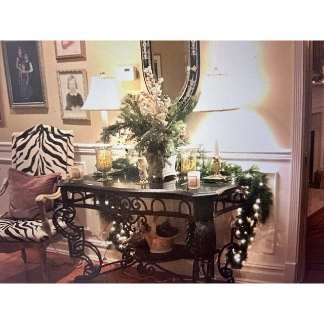 French Scrolled wrought iron and marble console in black with slight dark green on the curved portion of the leg . A...