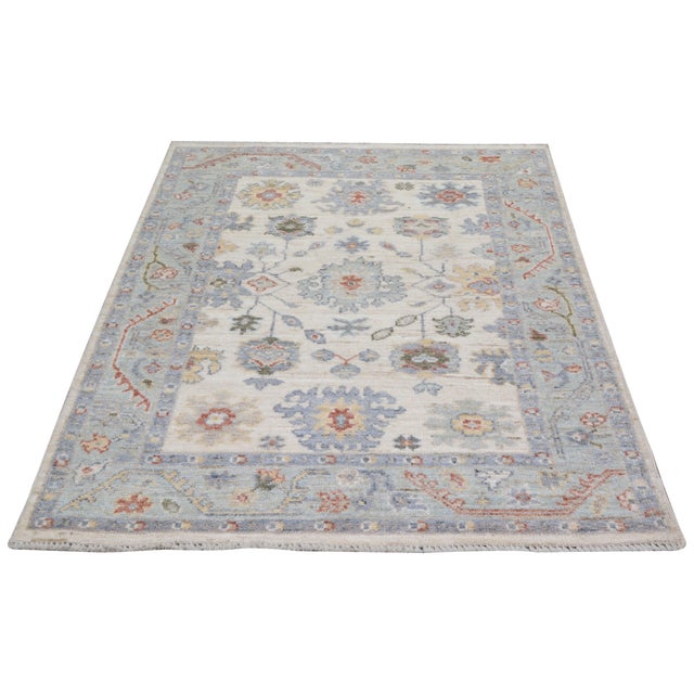 Turkish Oushak Hand-knotted with care using traditional rug-making techniques, this wool rug blends timeless craftsmanship...