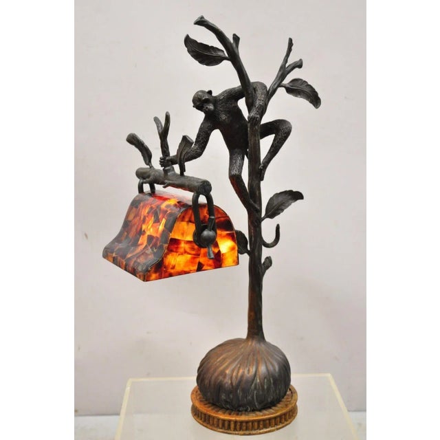 Maitland Smith Figural Bronze Monkey Desk Lamp with Pen Shell Shade. Item features original pen shell shade, cast bronze...