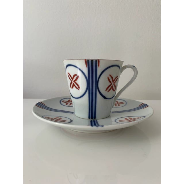 Elegant and simple mid century tea cups and saucers. Blue, white and maroon designs. Stripes that reach and extend from...