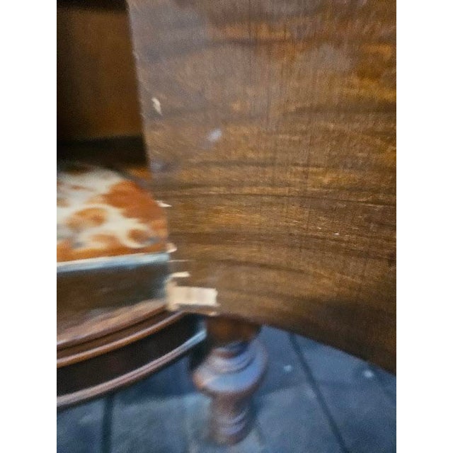 Stunning early 20th-century mahogany bedside table. Crafted around 1910-1920s, this unique piece features a tapered...