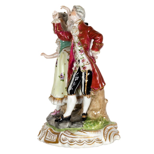 An 18th Century Baroque porcelain dancing couple figurine, crafted by Volkstedt, Muller & Co, Dresden. This figure...