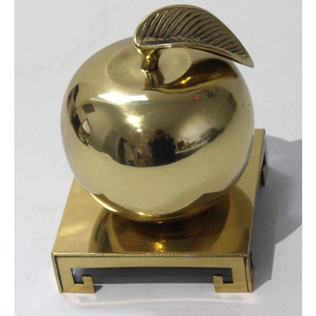 Vintage Paper Weight Apple Form in Polished Brass on a Separate Brass Stand. The apple paperweight measures 3 3/4 diameter...