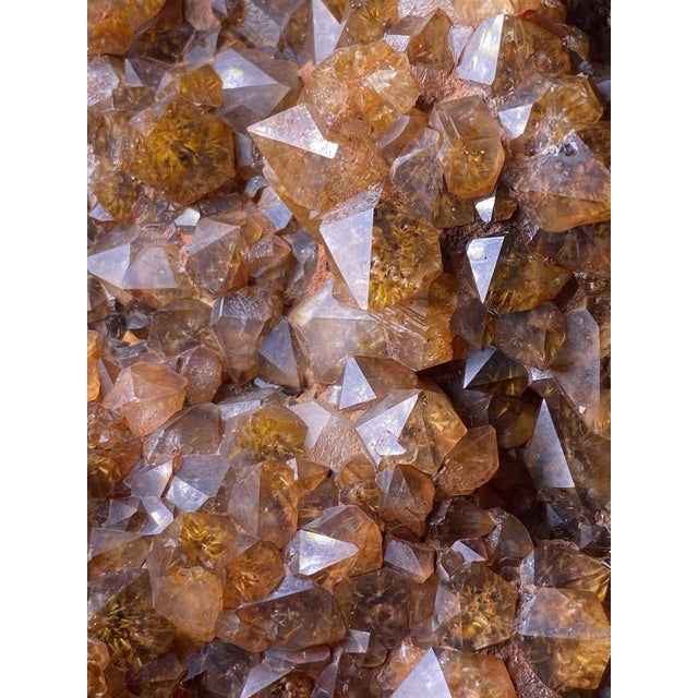 A monumental natural red rutilated quartz specimen selected for its sculptural scale, earthy ochre coloration, and raw...