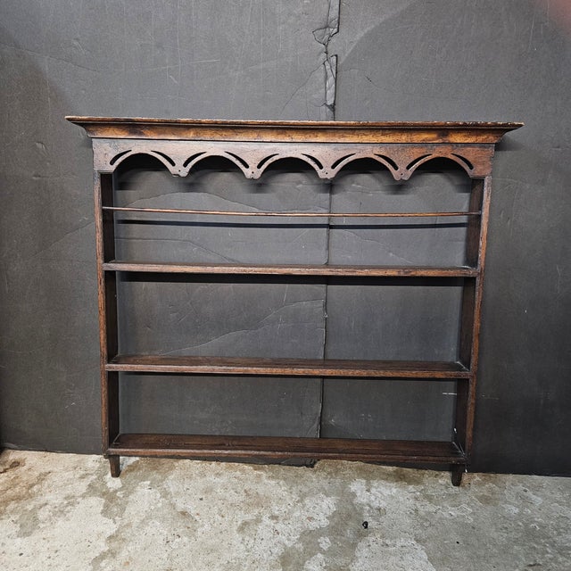 The patina on this 19th Century Oak Plate Rack With Shaped Frieze is beautiful. It has aged with grace and has a lot of...