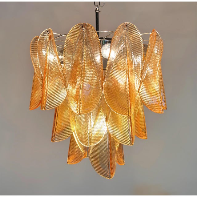 DUTIES FREE Elegant and sculptural Italian Murano glass chandelier attributed to Mazzega, crafted during the late 20th...