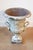 This impressive 19th-century French urn is crafted from cast iron and showcases exquisite detailing that reflects the...