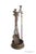 Antique brass fireplace tool set, having three tools, tongs, poker, shovel, and a stand. The handles have a nice hammered...