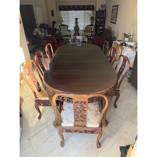 Oval carved rosewood dining table • Thick glass top (originally added to protect carving) • Dragon-carved apron (very...