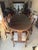 Oval carved rosewood dining table • Thick glass top (originally added to protect carving) • Dragon-carved apron (very...