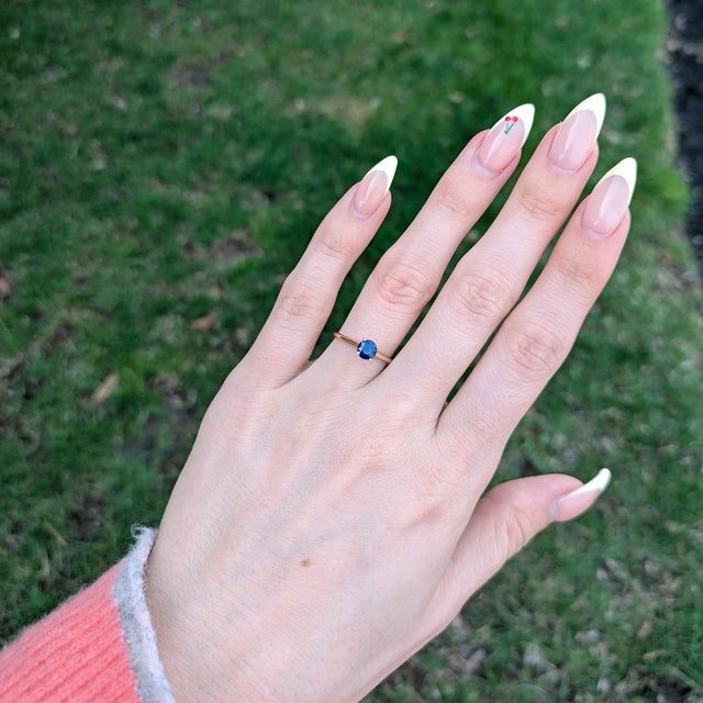 Natural Ceylon sapphire in a 5mm round solitaire, prized for its rich color and timeless appeal. Set in solid 14K gold,...