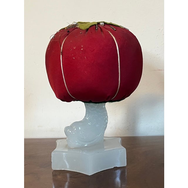 Large whimsical early 20th century "make-do" tomato form pin cushion mounted on a 19th c. dolphin clambroth Sandwich Glass...