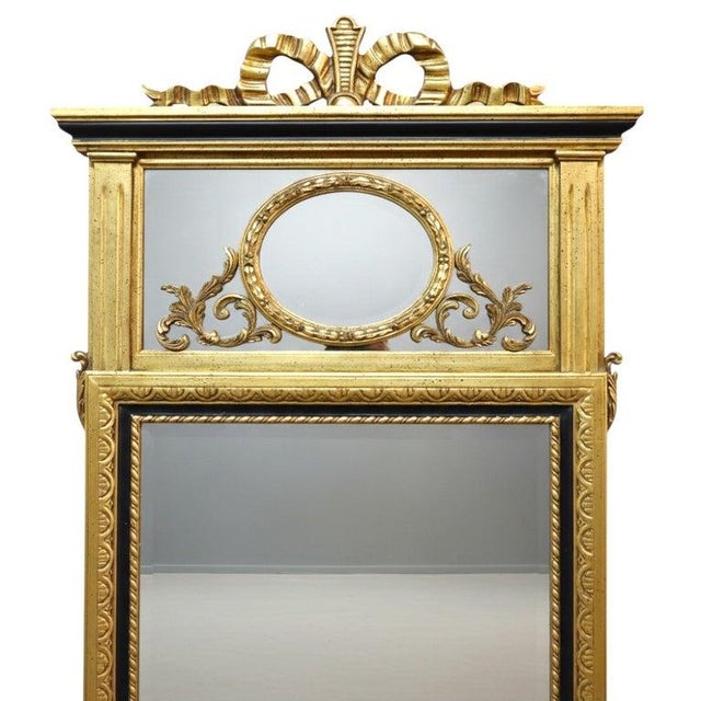 This vintage Italian pier mirror, dating to approximately 1940, features a design inspired by the Louis XV style. The...