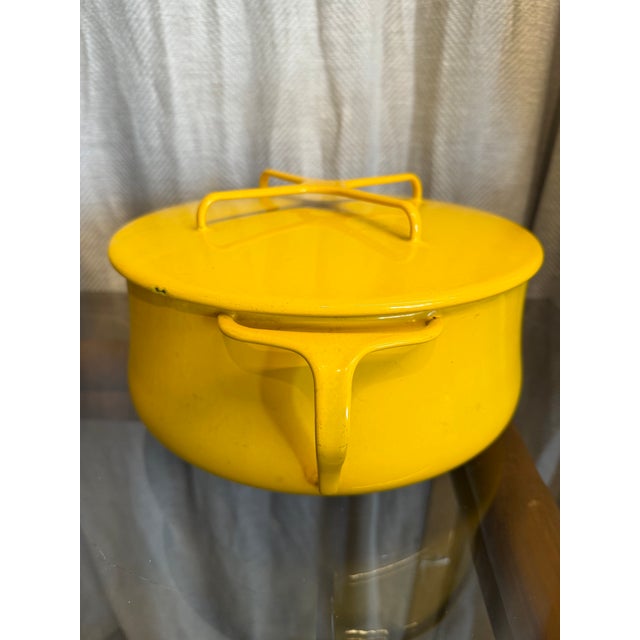 Jens H. Quistgaard (1919-2008), Midcentury Modern era, made in Denmark, lidded enameled pot in bright yellow.